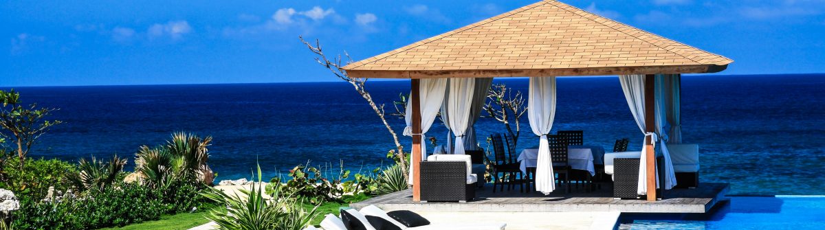 Luxury summerhouse with swimming pool on Atlantic ocean beach shutterstock_67081069-2